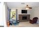 Cozy living room featuring a brick fireplace, neutral carpet, and natural light at 1310 Larkview Sw Dr, Lilburn, GA 30047