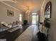 Elegant entryway showcasing dark floors, chandelier, seating and stylish decor at 1012 Institute Nw St, Conyers, GA 30012