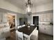 Spacious kitchen with ample counter space and a view of the dining room at 1012 Institute Nw St, Conyers, GA 30012