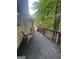 Relax on this back deck overlooking a green backyard; a shed is nearby with easy access to the main home at 2532 N Carroll Ct, Villa Rica, GA 30180