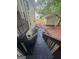 View from the back deck stairs of the lush back yard with a storage shed and mature trees at 2532 N Carroll Ct, Villa Rica, GA 30180