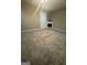 Cozy carpeted basement with an electric fireplace and neutral color scheme at 2532 N Carroll Ct, Villa Rica, GA 30180