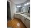 Bathroom features granite countertops, dual sinks and updated mirrors at 2532 N Carroll Ct, Villa Rica, GA 30180