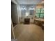 A luxurious bathroom featuring dual sinks, granite countertops, and a marble-encased soaking tub under a window at 2532 N Carroll Ct, Villa Rica, GA 30180