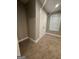 Bedroom featuring neutral walls, plush carpet, a closet, and a window with natural light at 2532 N Carroll Ct, Villa Rica, GA 30180