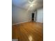 Bedroom boasts wood floor, ceiling fan and walk in closet at 2532 N Carroll Ct, Villa Rica, GA 30180