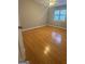 Bedroom boasts wood floor and ceiling fan at 2532 N Carroll Ct, Villa Rica, GA 30180