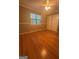 Bedroom boasts wood floor, ceiling fan and window at 2532 N Carroll Ct, Villa Rica, GA 30180