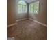 Cozy bedroom with natural light and neutral carpet at 2532 N Carroll Ct, Villa Rica, GA 30180