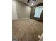Cozy bedroom featuring a plank accent wall and neutral carpet at 2532 N Carroll Ct, Villa Rica, GA 30180