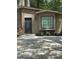 Inviting home exterior with neutral siding, black front door, and window box detail at 2532 N Carroll Ct, Villa Rica, GA 30180