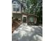 Additional view showing exterior entrance, driveway, and a beautifully landscaped side yard at 2532 N Carroll Ct, Villa Rica, GA 30180