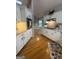Modern kitchen with granite countertops, white cabinets, and stainless steel oven at 2532 N Carroll Ct, Villa Rica, GA 30180