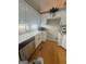 Kitchen boasts granite countertops, stainless steel dishwasher, and white cabinets at 2532 N Carroll Ct, Villa Rica, GA 30180