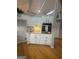 Bright kitchen features white cabinets, stainless steel oven and granite countertops at 2532 N Carroll Ct, Villa Rica, GA 30180