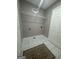 Bright laundry room with wire shelving, cream walls and tiled floor offers a tidy space at 2532 N Carroll Ct, Villa Rica, GA 30180