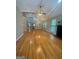 Spacious living room featuring hardwood floors, fireplace, ceiling fan and large windows at 2532 N Carroll Ct, Villa Rica, GA 30180