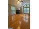 Spacious living room with hardwood floors, large windows, and a cozy fireplace at 2532 N Carroll Ct, Villa Rica, GA 30180