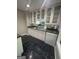 Close up of wet bar with upper and lower cabinets and a view to the window at 2532 N Carroll Ct, Villa Rica, GA 30180