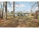 Expansive backyard featuring mature trees, a deck, a fire pit and plenty of space for outdoor activities at 456 Pretty View Se Ln, Smyrna, GA 30082