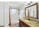 The bathroom offers a bathtub, shower combo, tile surround, updated vanity, and granite countertop, enhancing its charm at 456 Pretty View Se Ln, Smyrna, GA 30082