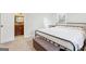 Bedroom with neutral walls, plush carpet, and an open bathroom, creating a serene and inviting atmosphere at 456 Pretty View Se Ln, Smyrna, GA 30082