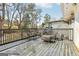 Wet wooden deck featuring classic outdoor furniture ideal for relaxation and enjoying outdoor living at 456 Pretty View Se Ln, Smyrna, GA 30082