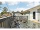 Partially covered wooden deck offering a cozy outdoor seating area with rustic wicker furniture at 456 Pretty View Se Ln, Smyrna, GA 30082