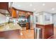 Spacious kitchen featuring stainless steel appliances, cherry cabinets, an island, and ample counter space at 456 Pretty View Se Ln, Smyrna, GA 30082