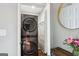 Laundry closet features stacked washer and dryer set and convenient shelving, maximizing space in the unit at 456 Pretty View Se Ln, Smyrna, GA 30082