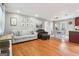 Open-concept living room featuring hardwood floors, neutral paint, and seamless flow into the dining area at 456 Pretty View Se Ln, Smyrna, GA 30082