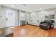Cozy living room with hardwood floors, natural light, neutral paint, and comfortable seating at 456 Pretty View Se Ln, Smyrna, GA 30082