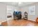The office has sleek hardwood floors, multiple monitors, and a comfortable gaming chair, perfect for productivity at 456 Pretty View Se Ln, Smyrna, GA 30082