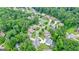 A prestigious neighborhood surrounded by dense forestry, highlighting a home with beautiful greenery at 6017 Chestatee Creek Nw Ct, Acworth, GA 30101