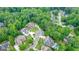 A lush, wooded neighborhood with a manicured home featuring a circular driveway on a quiet cul-de-sac at 6017 Chestatee Creek Nw Ct, Acworth, GA 30101
