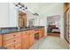The bathroom features wood cabinets with granite counters, a double vanity and access to the main bedroom at 6017 Chestatee Creek Nw Ct, Acworth, GA 30101