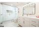Modern bathroom with a glass-enclosed shower, white vanity, and contemporary fixtures and mirror at 6017 Chestatee Creek Nw Ct, Acworth, GA 30101