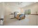 Cozy bedroom with neutral colors, a comfortable bed, and natural light from the window at 6017 Chestatee Creek Nw Ct, Acworth, GA 30101