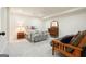 Comfortable bedroom with soft lighting, neutral walls, carpet and a white metal bed frame at 6017 Chestatee Creek Nw Ct, Acworth, GA 30101