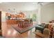 An open dining area with a table and chairs near the kitchen, fireplace, and living area at 6017 Chestatee Creek Nw Ct, Acworth, GA 30101