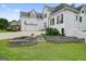 Elegant two-story white brick home boasts a manicured lawn, beautiful landscaping, and an attached two-car garage at 6017 Chestatee Creek Nw Ct, Acworth, GA 30101