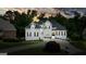 Beautiful two story home with a white exterior, black shutters and meticulously manicured lawn and driveway at 6017 Chestatee Creek Nw Ct, Acworth, GA 30101