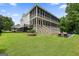 Two-story house with screened porch, fire pit and pool in the backyard at 6017 Chestatee Creek Nw Ct, Acworth, GA 30101