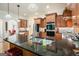 Kitchen island with stainless steel sink and appliances and hardwood floors at 6017 Chestatee Creek Nw Ct, Acworth, GA 30101