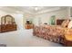 Serene main bedroom with a large bed, tray ceiling, and ample space with abundant natural light at 6017 Chestatee Creek Nw Ct, Acworth, GA 30101