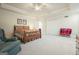 Spacious main bedroom featuring neutral tones, a ceiling fan, and plush carpeting with room to relax at 6017 Chestatee Creek Nw Ct, Acworth, GA 30101