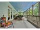 Spacious screened porch with seating area, ceiling fan, and an outdoor view, offering a relaxing space at 6017 Chestatee Creek Nw Ct, Acworth, GA 30101