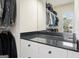 A closet countertop provides additional space in this luxury walk-in closet at 6017 Chestatee Creek Nw Ct, Acworth, GA 30101