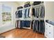 Organized walk-in closet features custom shelving, drawers and abundant storage space at 6017 Chestatee Creek Nw Ct, Acworth, GA 30101