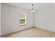 Well-lit dining room with hardwood floors and a window for natural lighting at 2714 Haynescrest Dr, Grayson, GA 30017
